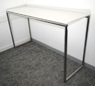 1 x High Leg Rectangular Breakout Table Workstation Featuring Chrome Legs Supporting a White Worktop