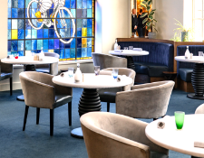 4 x Contemporary Tub Style Dining Chairs Featuring a Velvet Fabric and Faux Leather Seats