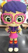 1 x Large 5ft Lego Brick Sculpture of a Cartoon Style Young Girl with Purple Hair and Pink Glasses