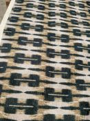 1 x 5 Metre Roll Of Contemporary Patterned Upholstery Fabric With A Geometric / Ikat Style Design In