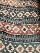 1 x 25 Metre Roll Of Of Southwestern / Tribal Pattern Upholstery Fabric Featuring A Multi-Coloured