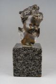 A small bronze portrait bust of a smiling child, signed to reverse Clodio, on marble plinth,