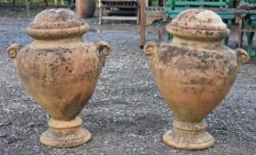 Pair of terracotta twin handled lidded urns, H 60cm x W 47cm (2)