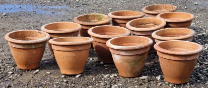 Set of twelve terracotta pots with incised Greek key detail, H 23cm x W 31cm (12)