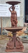 Large cast iron fountain with central nude water maiden column and two graduated urns with lobed