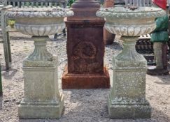 Haddonstone - Pair of weathered reconstituted stone regency style urns with lobed bowls, raised on
