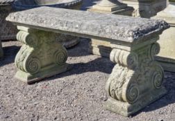 Haddonstone - Weathered reconstituted stone pedestal bench with scrolled ends and floral relief, H