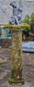 Weathered reconstituted stone birdbath with lead cherub surmount, H 150cm x W 44cm