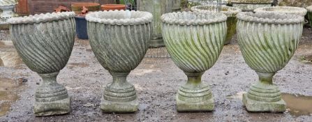 Set of four weathered reconstituted stone garden urns with spiral twist bowls, H 65cm x W 46cm (4)