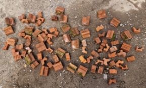 Large collection of terracotta stands / feet for planters