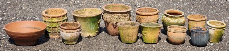 Thirteen terracotta pots of various size and design, largest H 28cm x W 30cm (13)