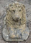 Reconstituted stone recumbent lion statue with glass eyes, H 36cm x W 32cm x D 74cm