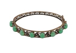Antique chrysoprase and colourless stone hinged bangle, the front designed as seven small oval