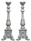 Pair of 20th century baroque style composite silvered candlesticks with acanthus leaf detail, H