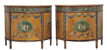 Pair of Sheraton style satinwood demi lune cabinets with painted floral detail, raised on square