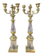 A pair of French brass and glass three-arm candelabra, with three scrolling acanthus arms and