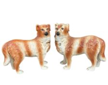 A pair of Victorian ceramic Staffordshire Border Collies, with gilt detail, H 29cm