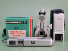 A rare Minox II subminiature "spy" camera. with original leather pouch, a Minox binocular attachment