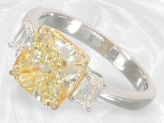 A valuable, as good as new diamond ring featuring a 4.02 ct green-yellow fancy diamond and 2 white e