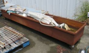 steel trough on casters 123" long x 23" wide x 13" deep walls