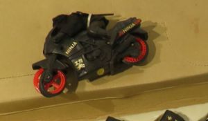 cases of 12 plastic die cast Ninja Rider friction powered