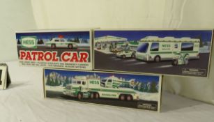 die cast Hess trucks (1) 1998 recreational van (1) 1995 trailer with helicopter, (1) 1993 Hess pa...