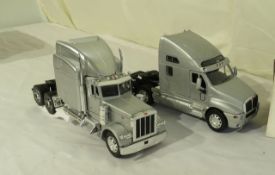 1:32 scale die cast (2) Peterbilt and (1) Kenworth
