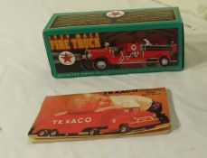 die cast 1929 Mack fire truck metal bank by ERTL and price guide book