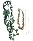 Two gem-set necklaces and a curb-link chain necklace