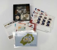 A selection of stamps and coins
