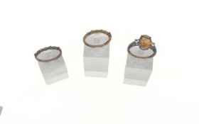 Three 9ct gold gem-set rings