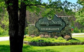 Build on this Half-Acre Lot in Lakes of the North, Michigan!