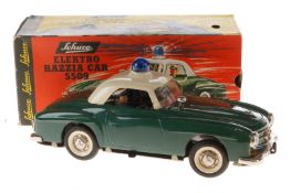 Schuco Elektro Razzia-Car 5509, grün/weiß, Uhrwerk intakt, mit 2 Figuren, LS und Alterungsspuren,