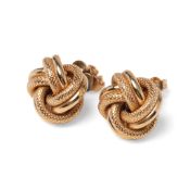 A pair of 9ct gold earrings formed as knots, with textured and smooth finish, fully hallmarked to