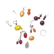 A group of jewellery including an elephant hair bangle wrapped in yellow metal, amber and resin