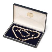 A pearl choker, with 9ct gold, garnet and seed pearl clasp, pearls of similar well matched size