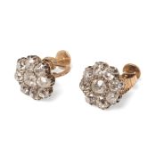 A pair of diamond flowerhead earrings, the central old European cut diamonds each of approximately