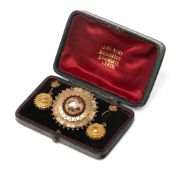 A 9ct gold Victorian Byzantine revival demi-parure, of earrings and brooch, all modelled with a