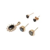 A group of 9ct gold set jewellery comprising a pair of dark blue sapphire stud earrings and a dark