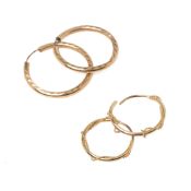 Two pairs of 9ct gold hoop earrings, one with rope detail, the other with textured decoration, total