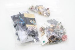 A large group of costume earrings, including marcasite, paste, faux pearls, drops, and glass.