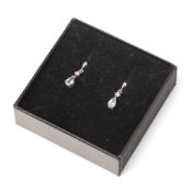 A pair of 9ct white gold, aquamarine and diamond drop earrings, set with small diamond over pear cut