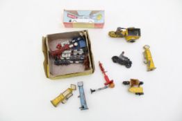 A group of Dinky toys to include street signs and petrol pumps, together with AA Patrolman on