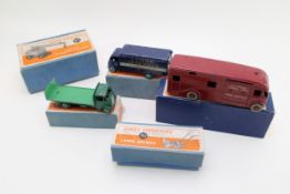 Boxed Dinky Toys comprising 513 Guy Flat Bed Truck, 514 Guy Van 'Lyons' livery and 581 Horse Box,