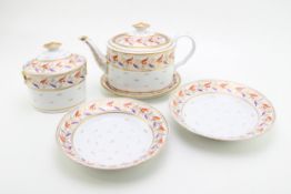 An early Coalport part tea set comprising teapot and stand, two deep dishes together with lidded