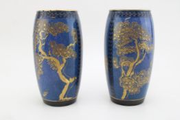 A pair of Royal Doulton vases, decorated with blue mottled decoration with gilt overlaid