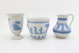 Wedgwood Blue on White Jasperware to include a jardiniere, 11cm tall, with a vase, 13.5cm tall and a