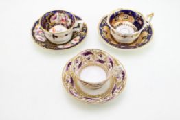 A John Yates cup and saucer in Neo classical design with cobalt blue ground and gilt decoration,