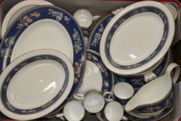 A Wedgwood dinner service in the Blue Siam pattern to include two oval vegetable dishes, two tureens