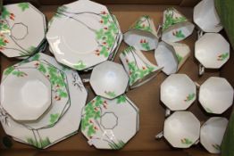 A Melba China Art Deco octagonal tea service to include ten cups, twelve saucers and twelve sandwich